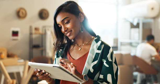 Businesswoman, tablet and smile for startup, business and social media marketing. Creative, technology and website for design company, work and new workplace for research, manager and strategy plan